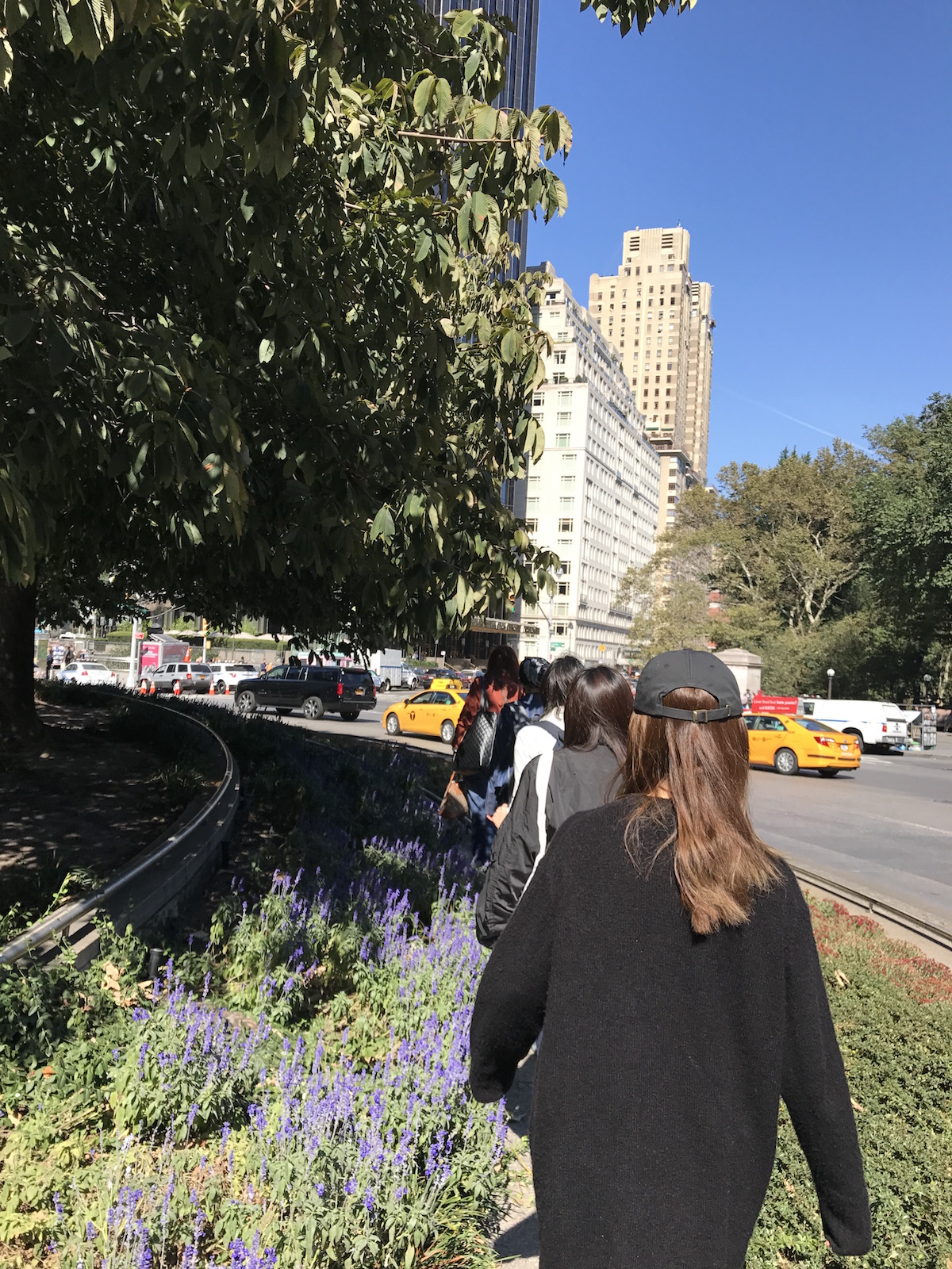 Arts Politics students walk in a line around Columbus Circle